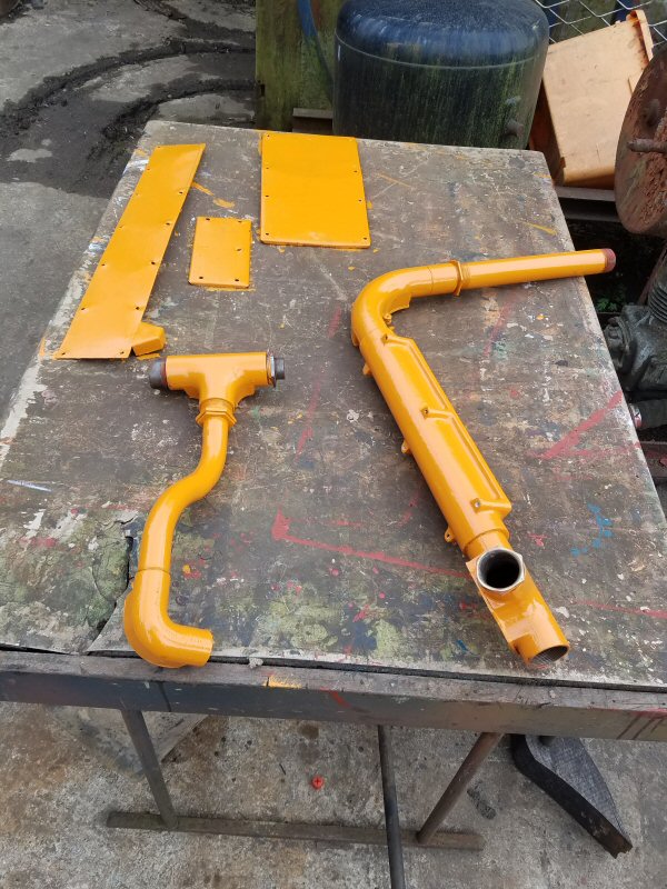 Class 100: Various items of electrical conduit painted orange